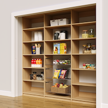 Natural oak 90 inch reach in pantry shelves with three wire pull-out baskets.