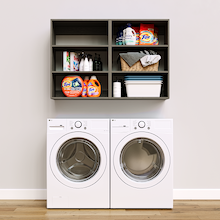 Grey Basic Laundry Kit featuring open overhead shelves installed above a washer and dryer to organize everyday laundry essentials. No