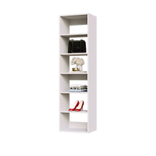 White 18 inch shelf tower for folded sweaters in a narrow closet.