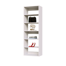 White 22.5 inch shelf tower for clothes in a reach-in closet.