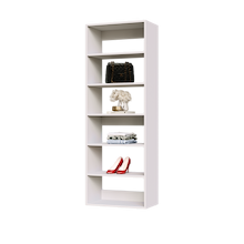 White 24 inch shelf tower for folded clothes in a walk-in closet.