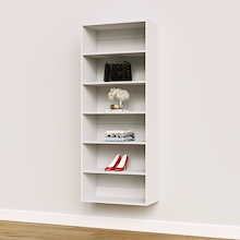 White 27 inch shelving tower for towels and laundry supplies.
