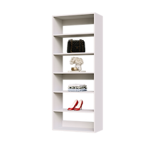 White 27 inch shelf tower for folded laundry in a closet.