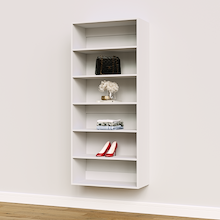 White 30 inch wide closet organizer for folded blankets and linens.