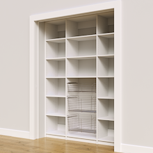 63 inch white reach in pantry shelving with three wire pull-out baskets.