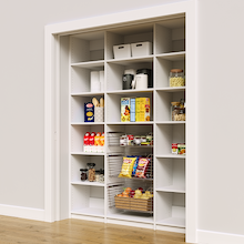 Ventilated 66 inch white pantry shelves with three sliding wire baskets.