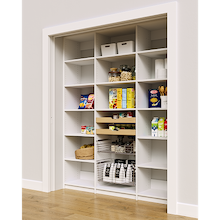 White 69 inch bulk pantry shelves with two wood pull-out drawers and two pull-out wire baskets.