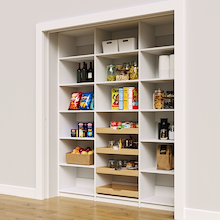 Large 72 inch white pantry shelving with four wood pull-out drawers.