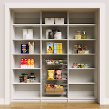 White 78 inch pantry with adjustable shelves and three wire baskets.
