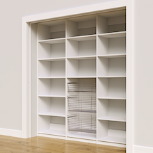 Three wire baskets for food storage in a 78 inch white kitchen pantry shelving unit.