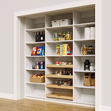 Sturdy 84 inch white reach in pantry shelves with four wood pull-out drawers.