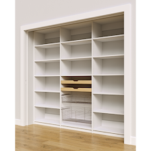 Side profile of white 93 inch pantry storage with two wood drawers and two pull-out wire baskets.