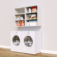 White Basic Laundry Kit with open overhead shelving installed above a washer and dryer for organized laundry room storage. No