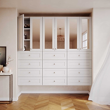 White 25.5 inch half closet doors with mirror panels installed in a small closet covering adjustable shelves.