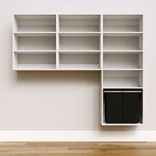 White Select Laundry Kit with a shelf tower with a pull-out hamper and overhead shelving installed above a washer and dryer providing built-in laundry room storage.