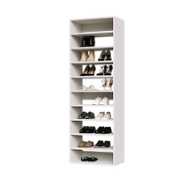 White shoe tower with 10 straight shelves for organized sneaker storage in a narrow reach-in closet.