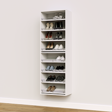 White shoe organizer with 8 slanted shelves for walk-in closet shoe storage.