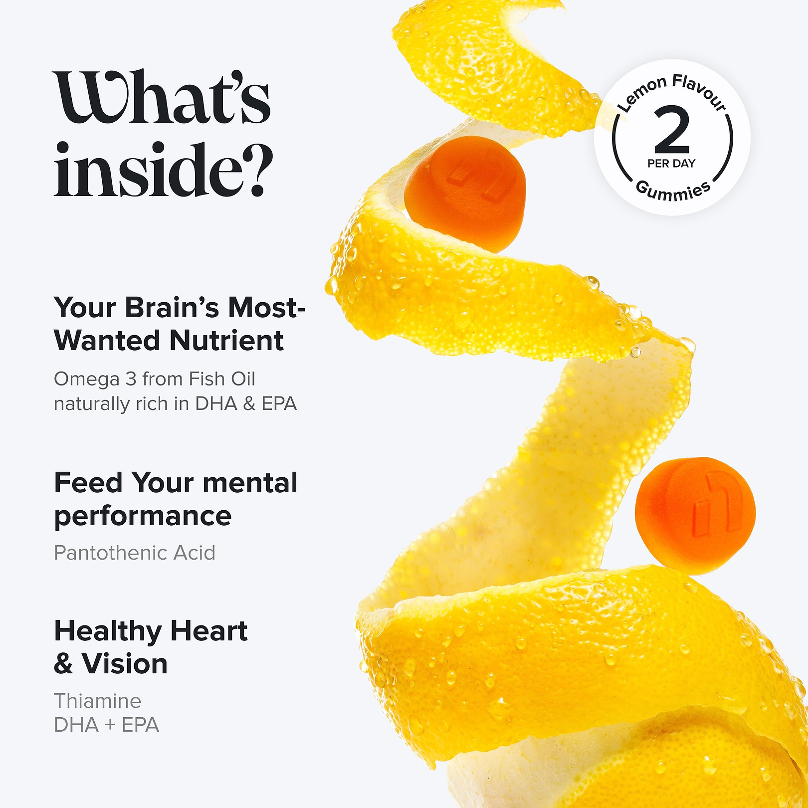 Orange gummies nestled in a lemon peel spiral with two loose gummies, badge reading 'Lemon Flavour Gummies, 2 Per Day.' Headline 'What's inside?' lists Omega 3 Fish Oil rich in DHA & EPA, Pantothenic Acid for mental performance, and Thiamine, DHA + EPA for heart and vision.