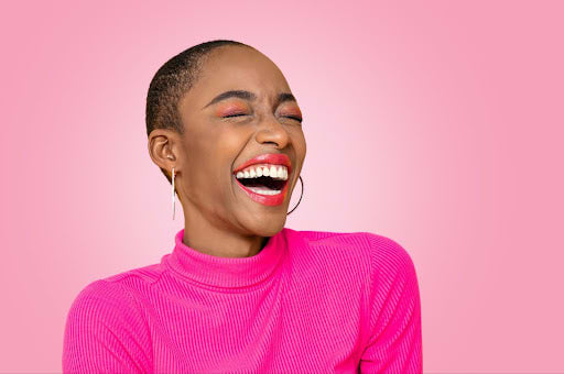 Women laughing and feeling good after a course of apple cider vinegar.