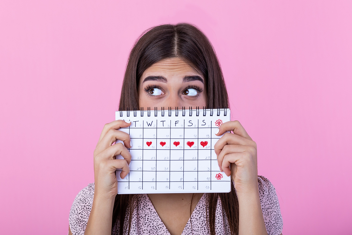 Woman who is about to come onto her period, struggling with fatigue and pain