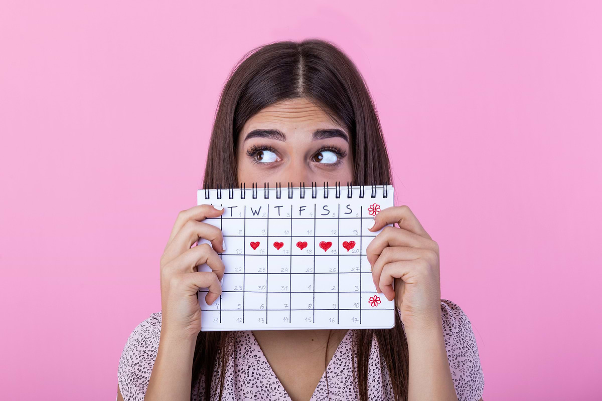 Woman who is about to come onto her period, struggling with fatigue and pain