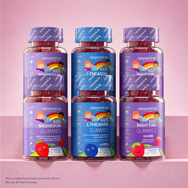 Six bottles of Novomins gummies for kids, arranged in two rows of three on a pink surface against a pink background. The bottles contain red gummies and have purple and blue labels with colorful cartoon illustrations of children.