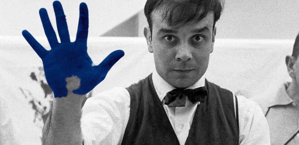 This image features the French artist Yves Klein, famous for developing his signature deep blue color, International Klein Blue (IKB). 