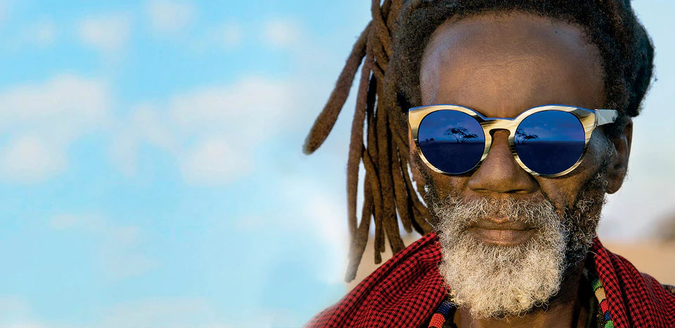 This image showcases a pair of sunglasses from the Etnia Barcelona collection, likely from the "Wild Love in Africa" series photographed by Steve McCurry. 