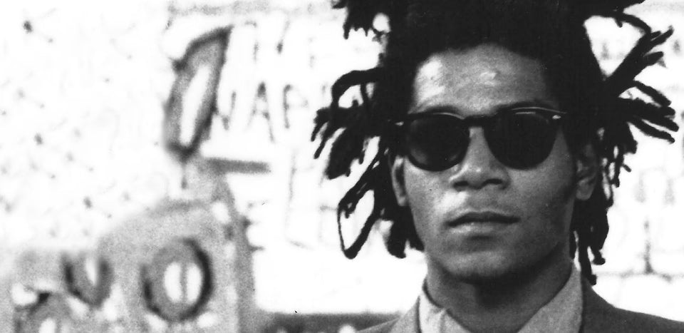 This image shows the renowned American artist Jean-Michel Basquiat. 