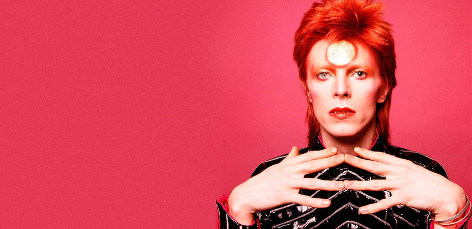 This image captures a iconic moment featuring David Bowie as his alter ego Ziggy Stardust, photographed by Masayoshi Sukita in 1973. 