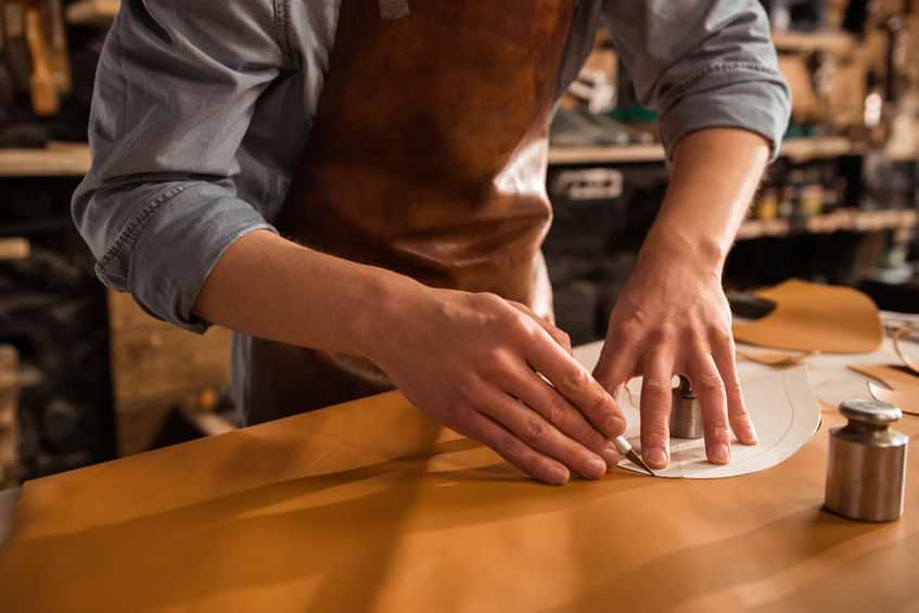 A picture containing person, table, indoor, preparing Description automatically generated