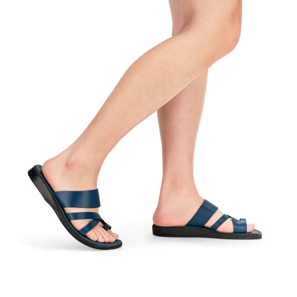 Model wearing The Good Shepherd in blue, handmade leather sandals with a toe loop