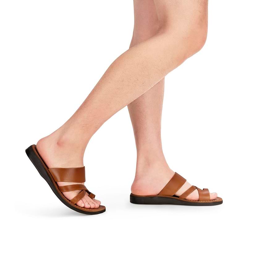 Model wearing The Good Shepherd in honey, handmade leather sandals with a toe loop