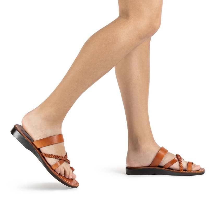 Model wearing Sophia in honey, handmade leather sandals with toe loop and cross straps