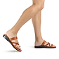Model wearing Sophia in honey, handmade leather sandals with toe loop and cross straps