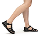 Model wearing Daniel Black closed toe leather sandal - side view