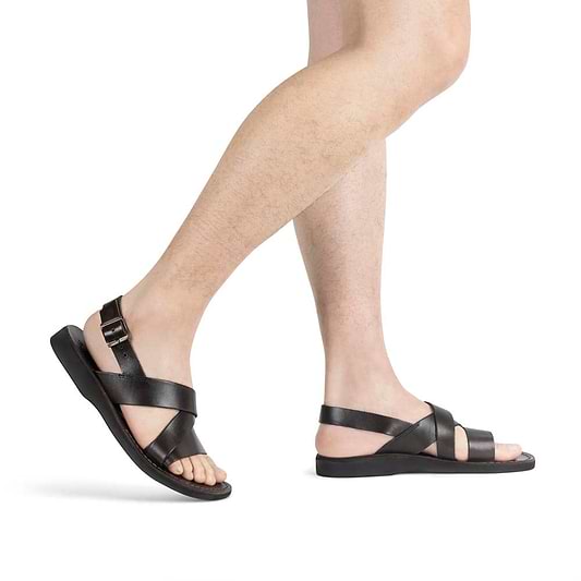 Model wearing Elisha brown, handmade leather sandals with back strap