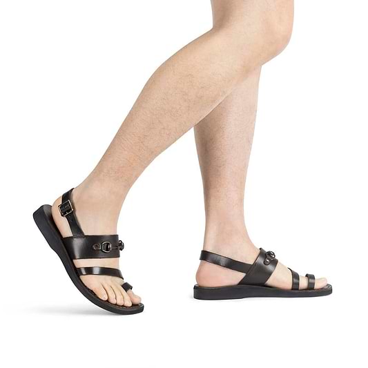Model wearing Eliphaz brown, handmade leather sandals with back strap and toe loop