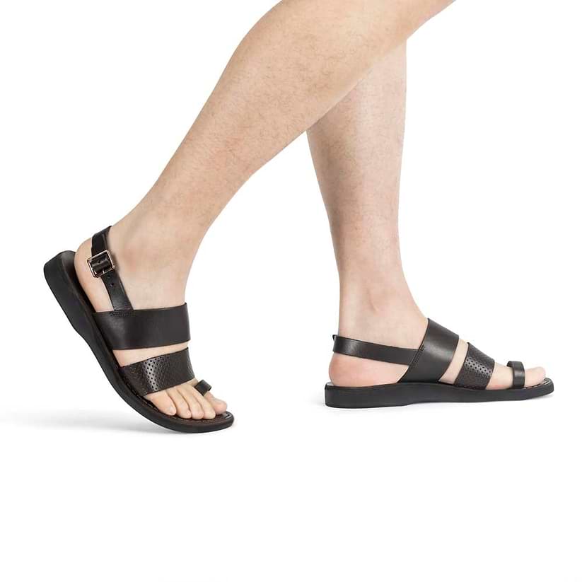 Model wearing Simon brown, handmade leather sandals with back strap and toe loop