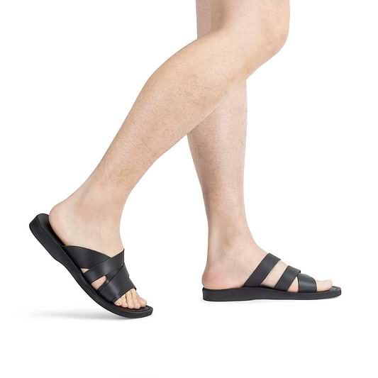 Model wearing Lucas black, handmade leather slide sandals