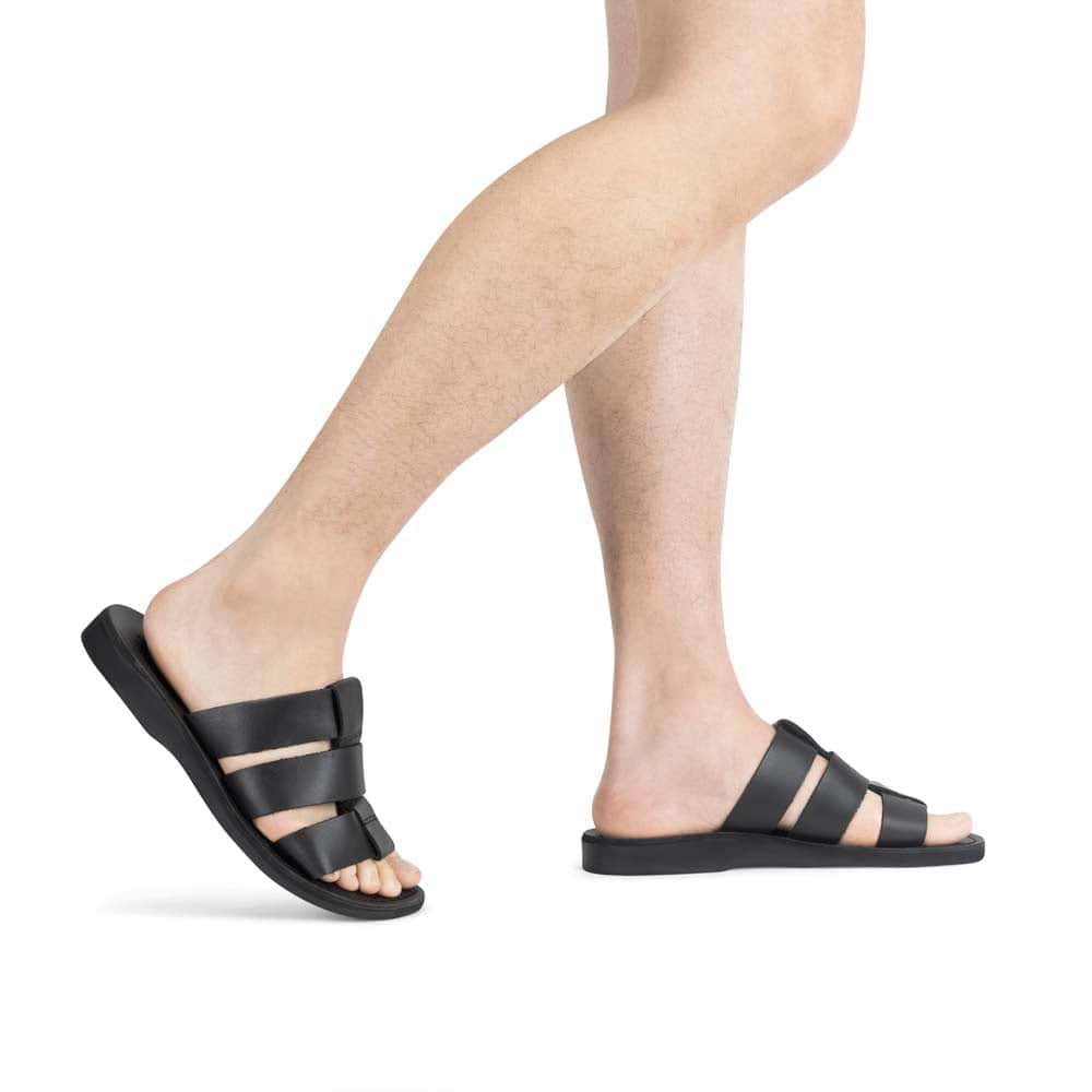 Model wearing Micah black, handmade leather slide sandals
