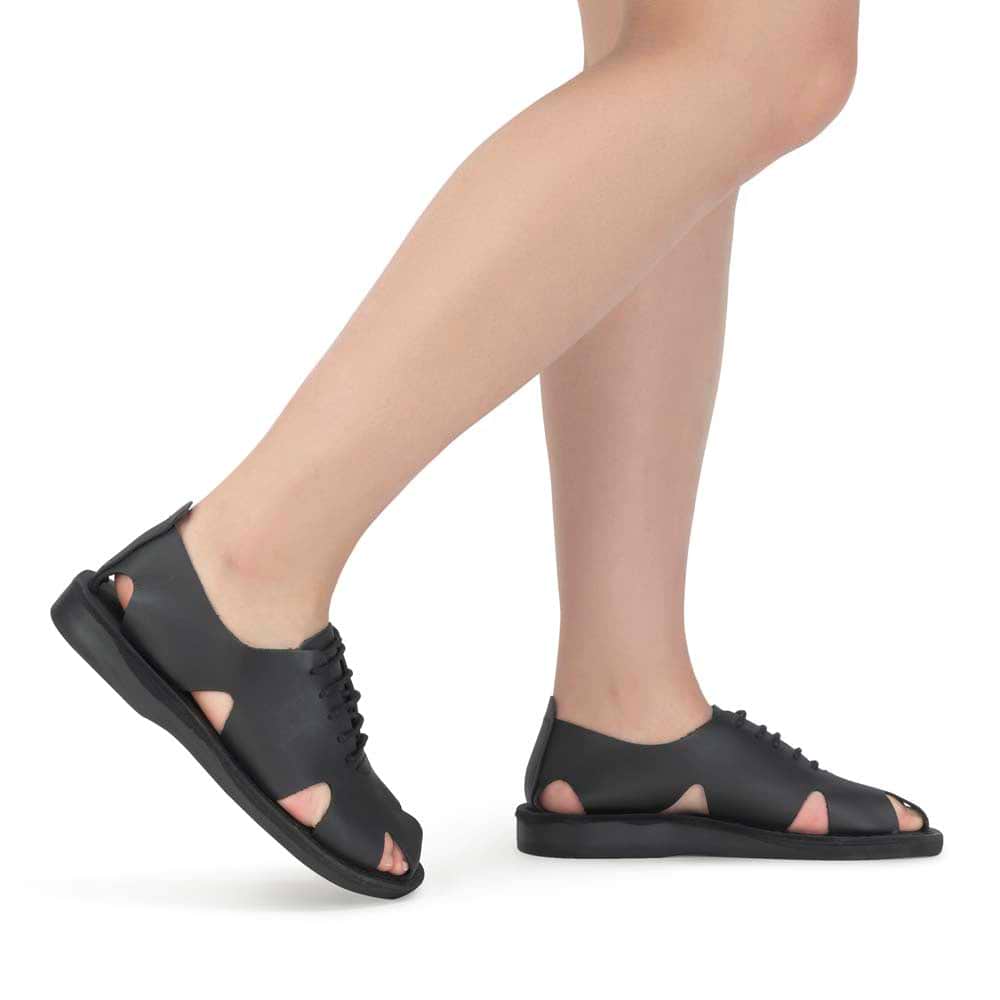 Model wearing River Black leather lace-up sandal - side view