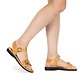 Model wearing The Original tan, handmade leather sandals with back strap