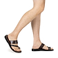 Model wearing Zohar brown, handmade leather slide sandals with toe loop