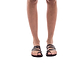 Model wearing Nora brown, handmade leather slide sandals with toe loop 