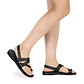 Model wearing Benjamin black, handmade leather sandals with back strap and toe loop