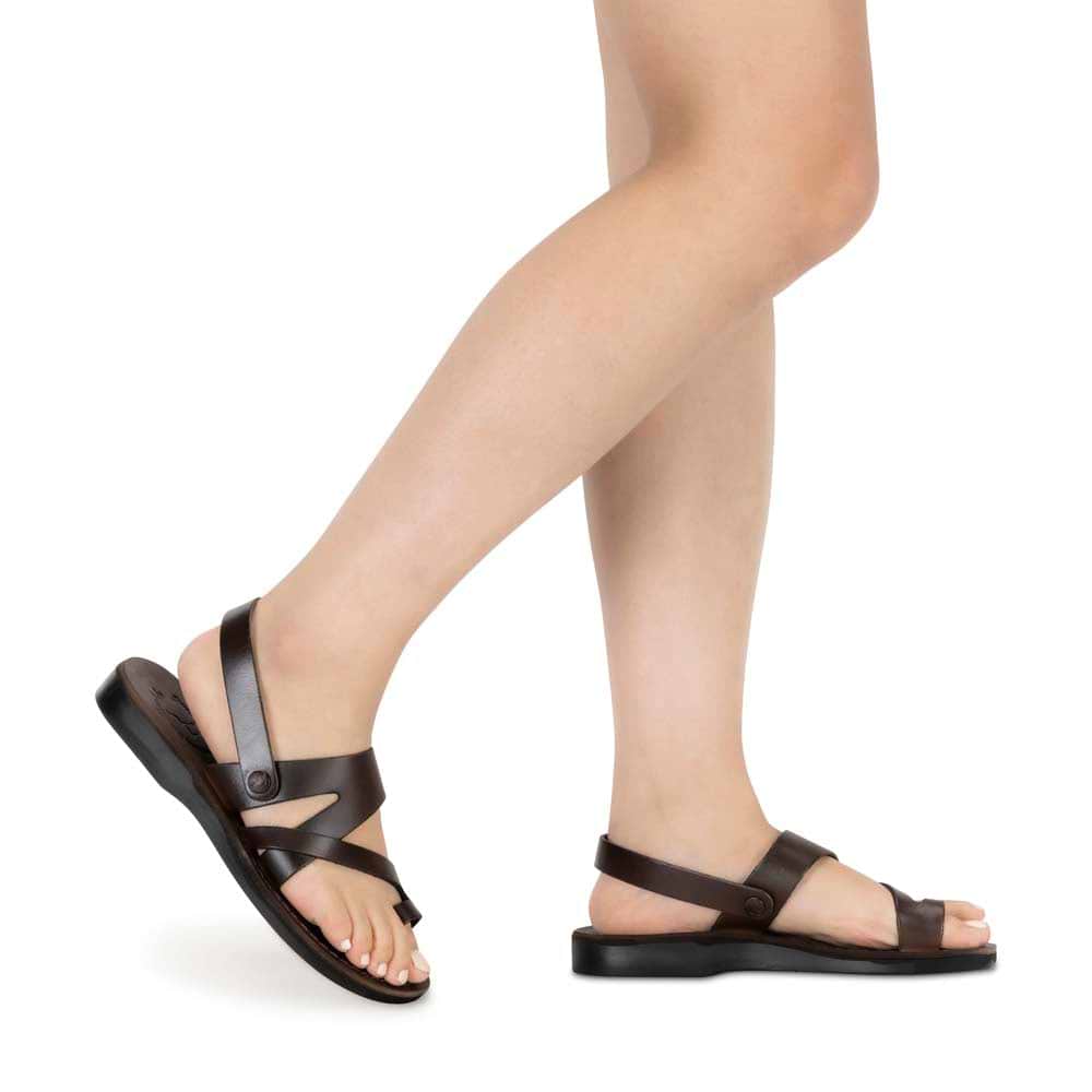 Model wearing Benjamin brown, handmade leather sandals with back strap and toe loop