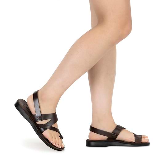 Model wearing Benjamin brown, handmade leather sandals with back strap and toe loop