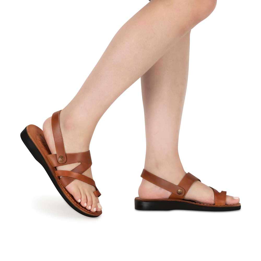 Model wearing Benjamin honey, handmade leather sandals with back strap and toe loop