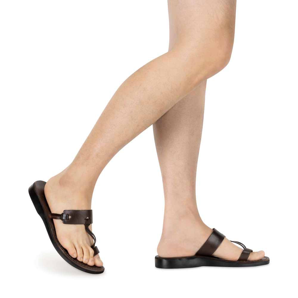 Model wearing David brown, handmade leather slide sandals with toe loop